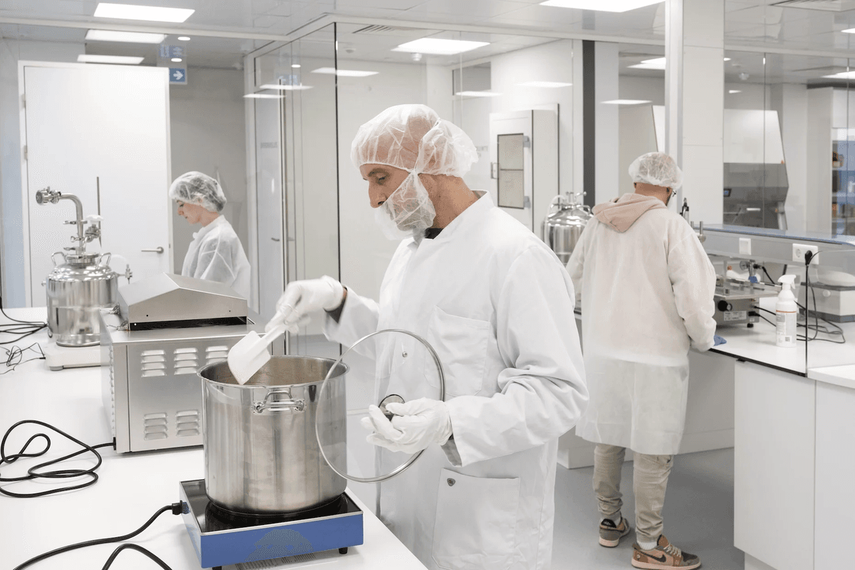 Pharmacist stirring medicine